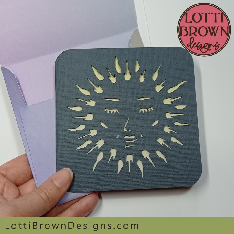 Celestial sun face card in dark blue-grey